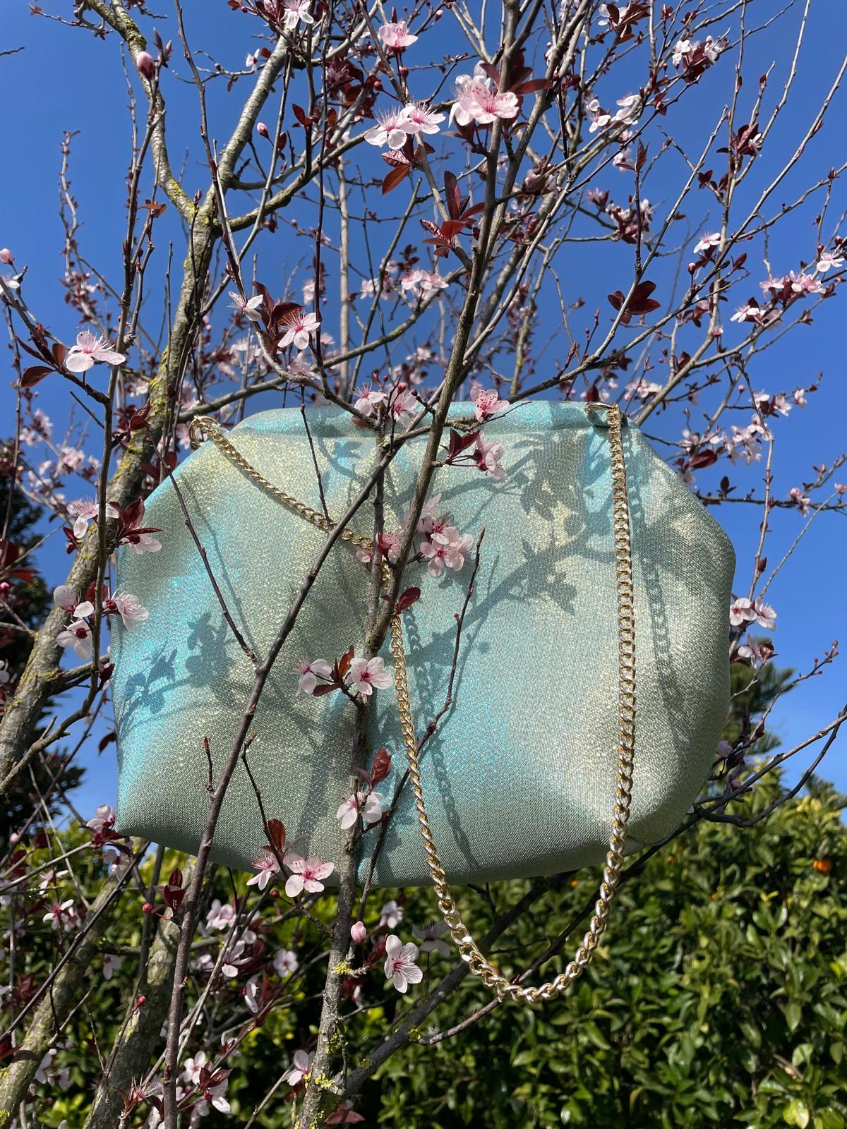 Borsa Starling in tessuto dorato cangiante con chiusura clic-clac